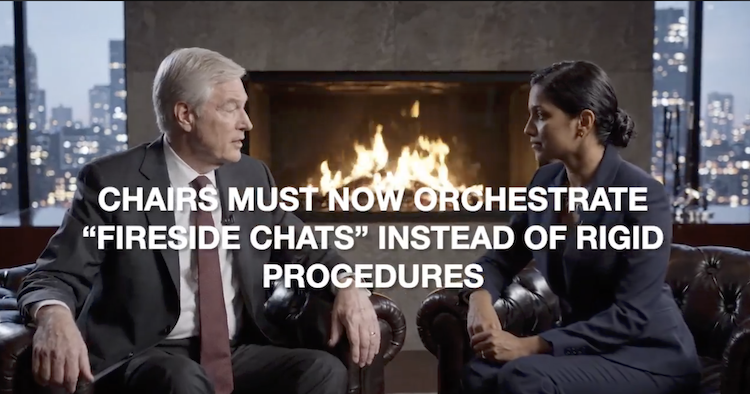 A man and a woman in business attire conducting a 'fireside chat' in a professional boardroom, illustrating the shift in New Zealand board governance for high earners under the Employment Relations Amendment Act 2026 $200,000 remuneration threshold, which replaces rigid performance procedures with strategic leadership dialogues.